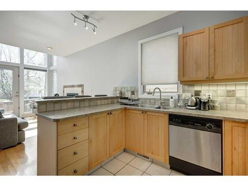 1-2322 2 Avenue Nw, Calgary, AB - Indoor Photo Showing Kitchen With Double Sink