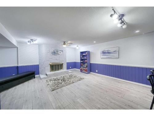 302 Silverthorn Close, Olds, AB - Indoor Photo Showing Other Room With Fireplace