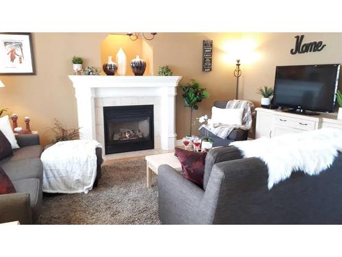 55 Crystalridge Crescent, Okotoks, AB - Indoor Photo Showing Living Room With Fireplace