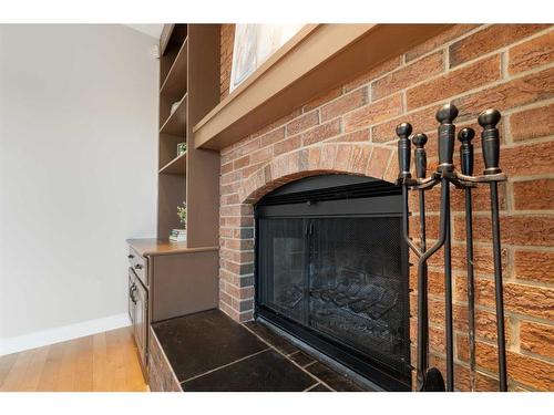 119 Cedargrove Court Sw, Calgary, AB - Indoor With Fireplace