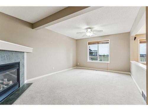 262 Cougarstone Circle Sw, Calgary, AB - Indoor With Fireplace