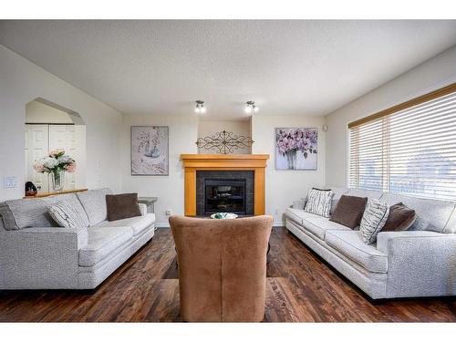 424 New Brighton Drive Se, Calgary, AB - Indoor Photo Showing Living Room With Fireplace