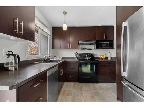 211 Marlyn Place Ne, Calgary, AB - Indoor Photo Showing Kitchen With Double Sink