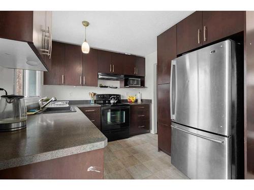 211 Marlyn Place Ne, Calgary, AB - Indoor Photo Showing Kitchen With Double Sink With Upgraded Kitchen
