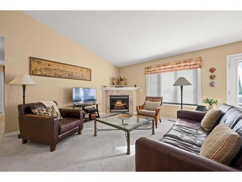 20-31243 Range Road 15, Rural Mountain View County, AB - Indoor Photo Showing Living Room With Fireplace