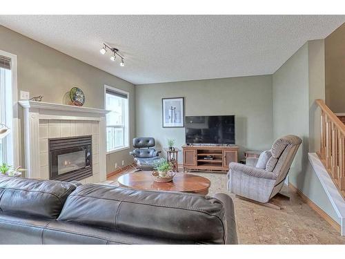 28 Silvergrove Close Nw, Calgary, AB - Indoor Photo Showing Living Room With Fireplace