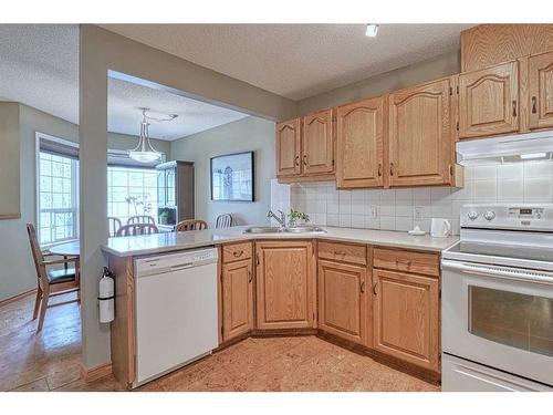 28 Silvergrove Close Nw, Calgary, AB - Indoor Photo Showing Kitchen With Double Sink