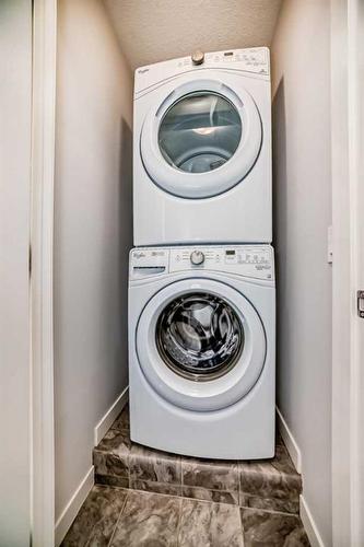 1605-205 Fireside View, Cochrane, AB - Indoor Photo Showing Laundry Room
