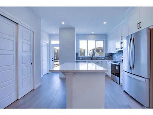 221 Chelsea Pl Place, Chestermere, AB - Indoor Photo Showing Kitchen With Upgraded Kitchen