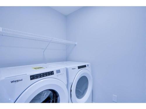 221 Chelsea Pl Place, Chestermere, AB - Indoor Photo Showing Laundry Room