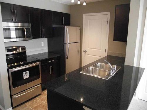 3402-1317 27 Street Se, Calgary, AB - Indoor Photo Showing Kitchen With Stainless Steel Kitchen With Double Sink