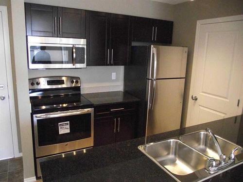 3402-1317 27 Street Se, Calgary, AB - Indoor Photo Showing Kitchen With Stainless Steel Kitchen With Double Sink