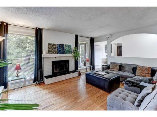 3324 60 Street Ne, Calgary, AB - Indoor Photo Showing Living Room With Fireplace