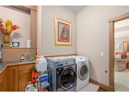 86 Slopes Point Sw, Calgary, AB - Indoor Photo Showing Laundry Room