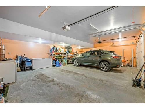 86 Slopes Point Sw, Calgary, AB - Indoor Photo Showing Garage