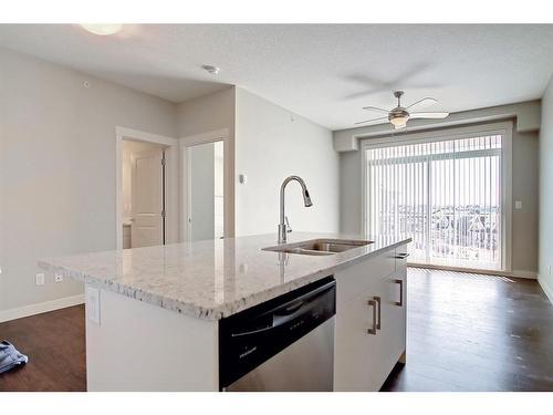 419-130 Auburn Meadows View Se, Calgary, AB - Indoor Photo Showing Kitchen With Double Sink With Upgraded Kitchen