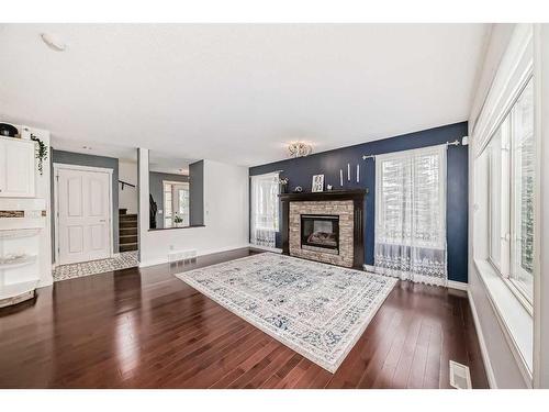 13 Everwillow Boulevard Sw, Calgary, AB - Indoor Photo Showing Living Room With Fireplace