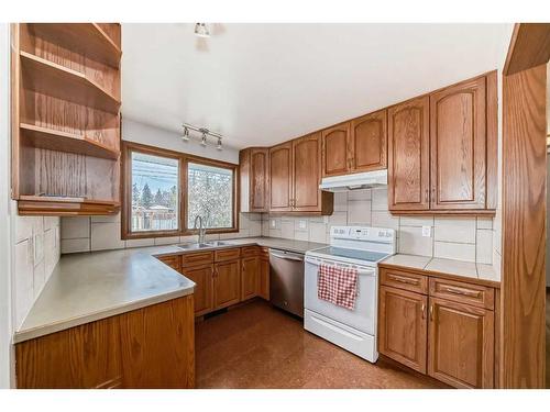 128 Glenpatrick Drive Sw, Calgary, AB - Indoor Photo Showing Kitchen With Double Sink