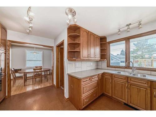 128 Glenpatrick Drive Sw, Calgary, AB - Indoor Photo Showing Kitchen With Double Sink