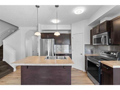 38 Sage Hill Common Nw, Calgary, AB - Indoor Photo Showing Kitchen With Stainless Steel Kitchen With Double Sink With Upgraded Kitchen