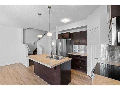 38 Sage Hill Common Nw, Calgary, AB - Indoor Photo Showing Kitchen With Double Sink With Upgraded Kitchen