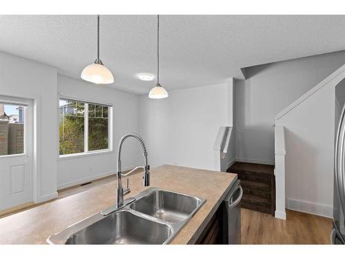 38 Sage Hill Common Nw, Calgary, AB - Indoor Photo Showing Kitchen With Double Sink