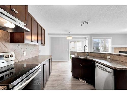 81 Royal Crest View Nw, Calgary, AB - Indoor Photo Showing Kitchen With Double Sink