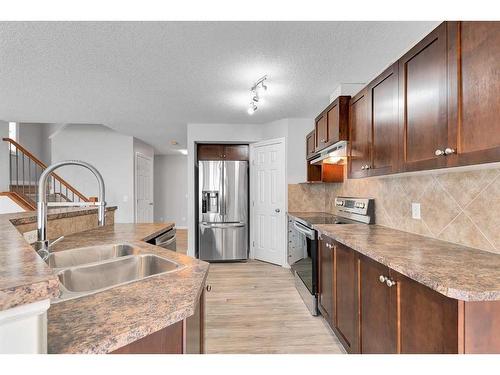 81 Royal Crest View Nw, Calgary, AB - Indoor Photo Showing Kitchen With Double Sink