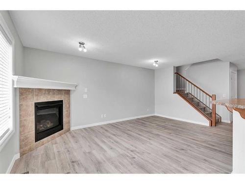 81 Royal Crest View Nw, Calgary, AB - Indoor With Fireplace