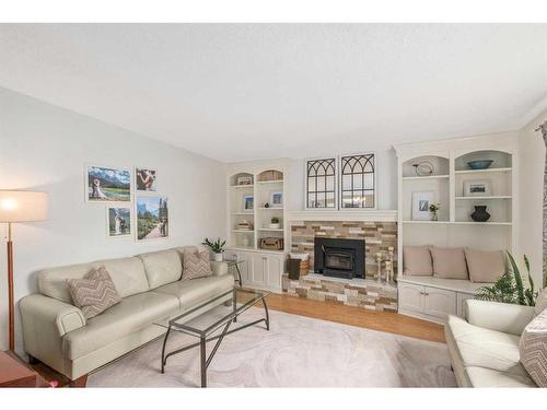 715 Canterbury Drive Sw, Calgary, AB - Indoor Photo Showing Living Room With Fireplace
