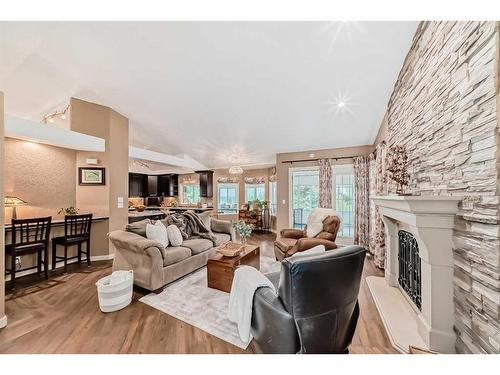 271214 Range Road 13 Nw, Airdrie, AB - Indoor Photo Showing Living Room With Fireplace