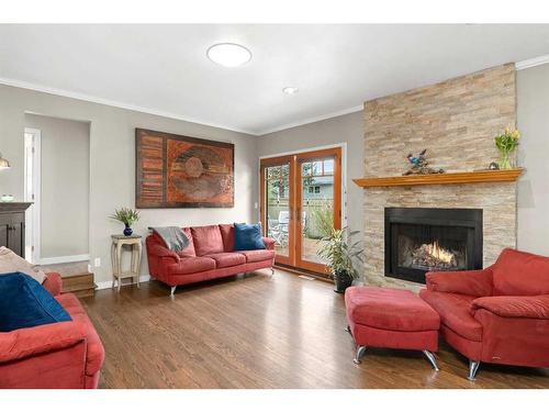 112 Woodside Bay Sw, Calgary, AB - Indoor Photo Showing Living Room With Fireplace