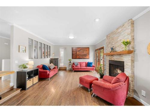 112 Woodside Bay Sw, Calgary, AB - Indoor Photo Showing Living Room With Fireplace