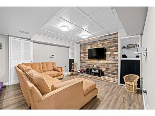 112 Woodside Bay Sw, Calgary, AB - Indoor With Fireplace