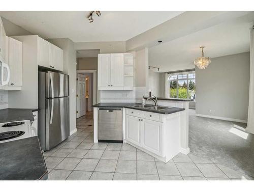 302-910 70 Avenue Sw, Calgary, AB - Indoor Photo Showing Kitchen With Double Sink