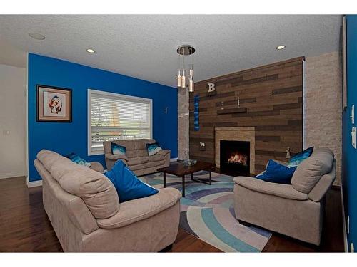 148 Sherwood Rise Nw, Calgary, AB - Indoor Photo Showing Living Room With Fireplace
