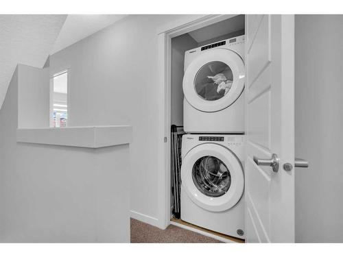402-260 Rowley Way Nw, Calgary, AB - Indoor Photo Showing Laundry Room
