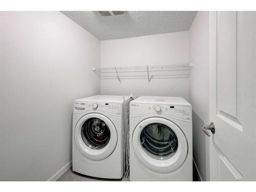 40 Cranford Park Se, Calgary, AB - Indoor Photo Showing Laundry Room