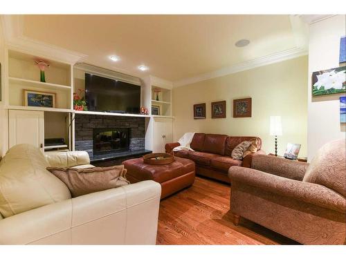 6948 Livingstone Drive Sw, Calgary, AB - Indoor Photo Showing Living Room With Fireplace