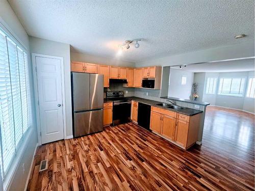 58 Royal Birch Villas Nw, Calgary, AB - Indoor Photo Showing Kitchen With Double Sink