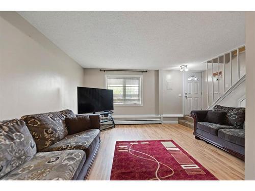 112-3809 45 Street Sw, Calgary, AB - Indoor Photo Showing Living Room