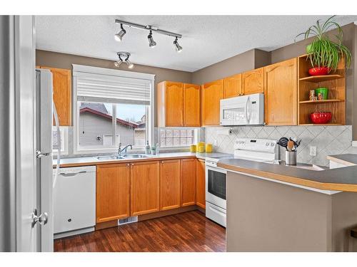 161 Tuscany Springs Way Nw, Calgary, AB - Indoor Photo Showing Kitchen With Double Sink
