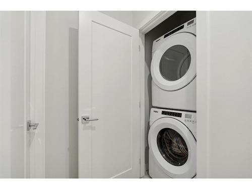 203-830 78 Street Sw, Calgary, AB - Indoor Photo Showing Laundry Room