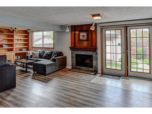 220 Templewood Road Ne, Calgary, AB - Indoor Photo Showing Living Room With Fireplace