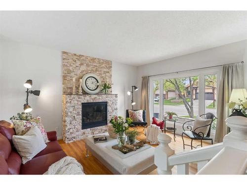 16 Woodglen Gate Sw, Calgary, AB - Indoor Photo Showing Living Room With Fireplace