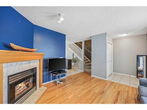8 Country Village Landing Ne, Calgary, AB - Indoor Photo Showing Living Room With Fireplace