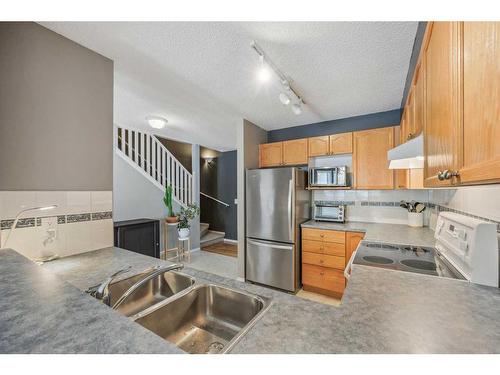 8 Country Village Landing Ne, Calgary, AB - Indoor Photo Showing Kitchen With Double Sink