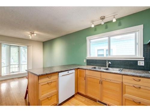 306 11 Street Nw, Calgary, AB - Indoor Photo Showing Kitchen With Double Sink