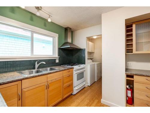 306 11 Street Nw, Calgary, AB - Indoor Photo Showing Kitchen With Double Sink