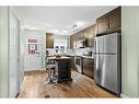 206-2400 Ravenswood View Se, Airdrie, AB  - Indoor Photo Showing Kitchen 